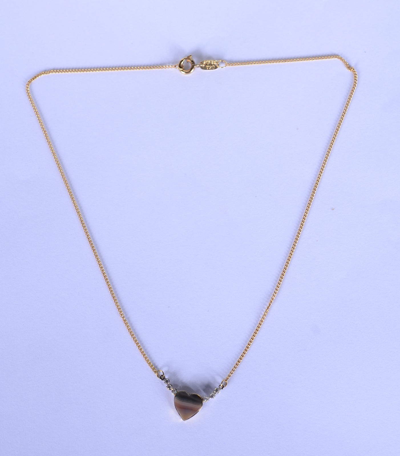 Colar com pendente feitio coração com pedra azul e 6 diamantes de... - foto 2 de 7