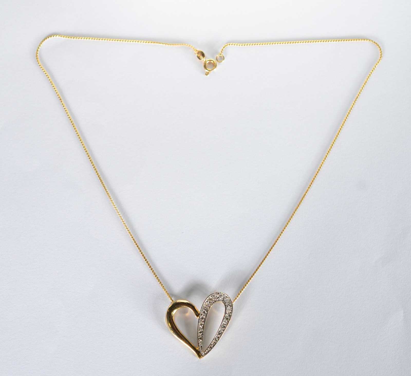Colar com pendente feitio coração com vazados de ouro 18 k... - foto 1 de 7