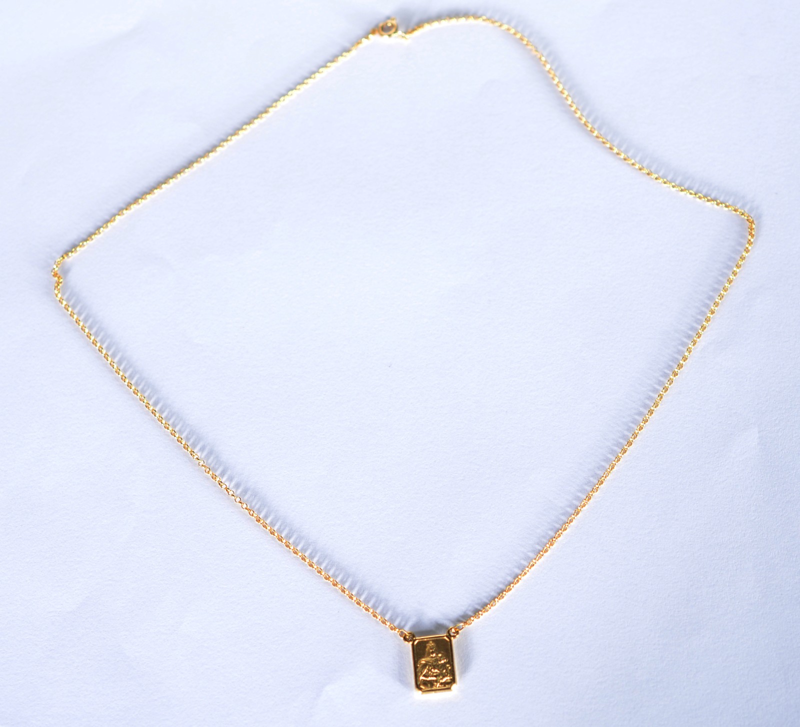 Colar com medalha de ouro 18 k., contraste 750 mls. (Por motivos de... - foto 2 de 6