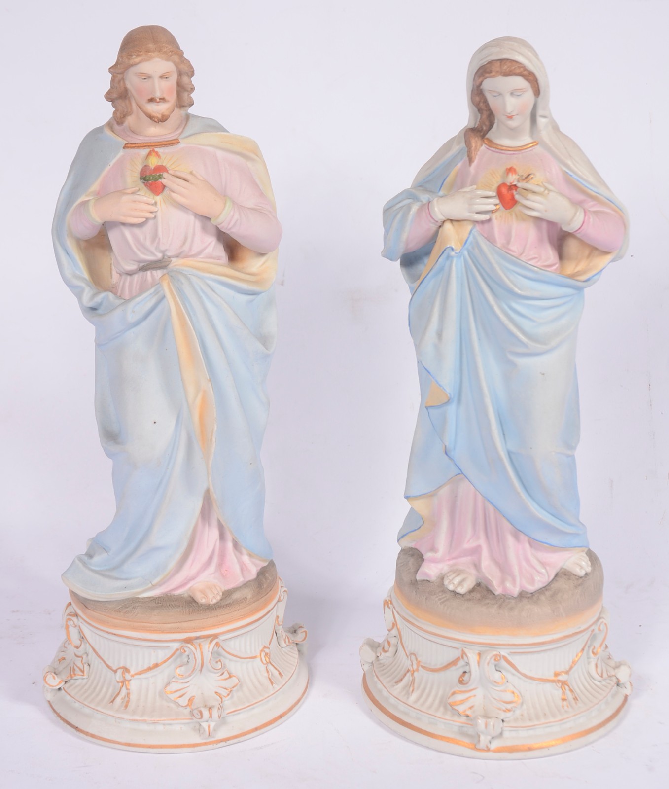 Par de estatuetas de porcelana policromada representando Sagrado... - foto 1 de 7