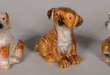Nove mini esculturas de porcelana representando... - Nove mini esculturas de porcelana representando cachorros.