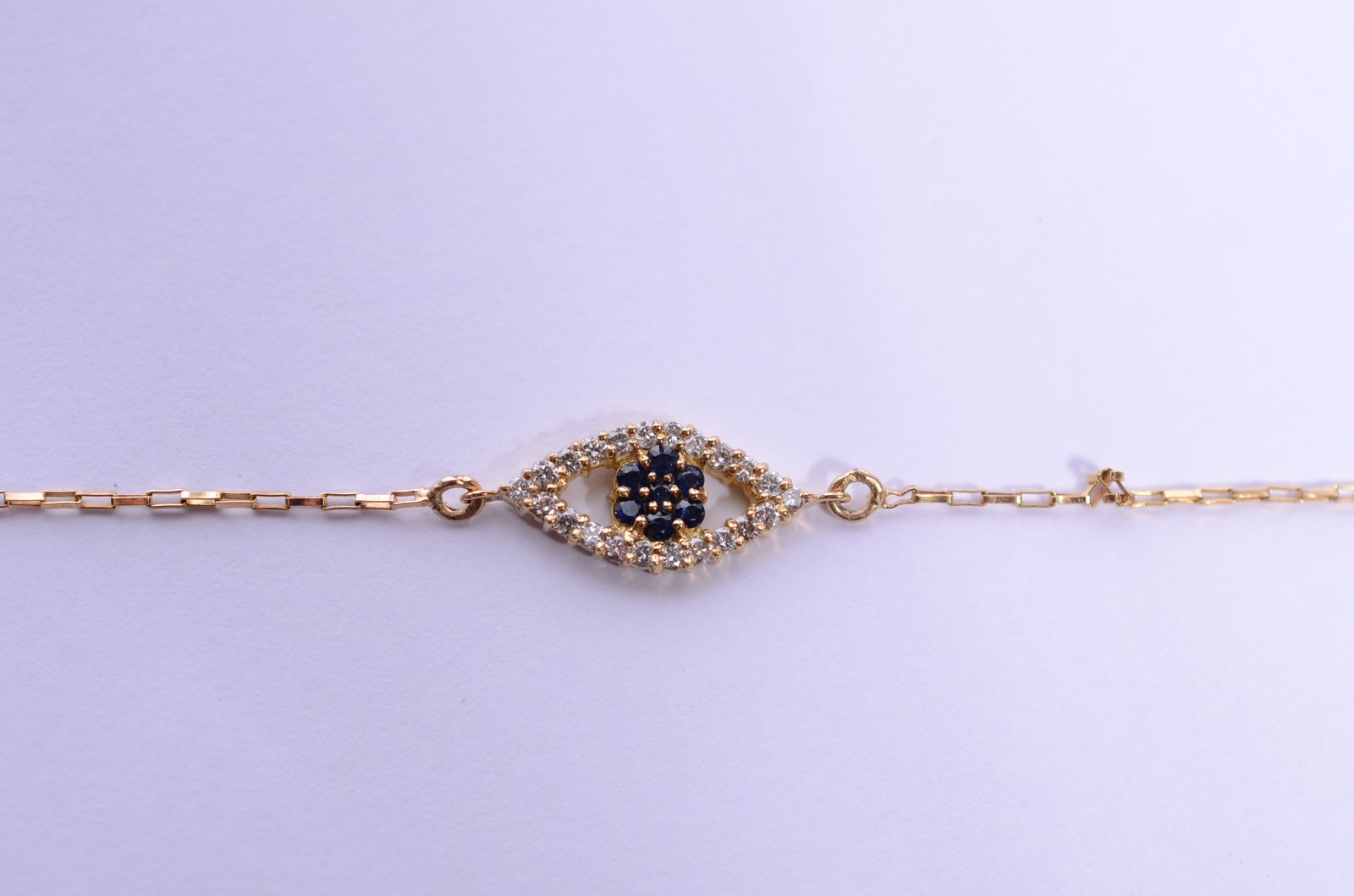 Colar com pendente feitio olho grego de ouro 18 k. (Por motivos de... - foto 1 de 6