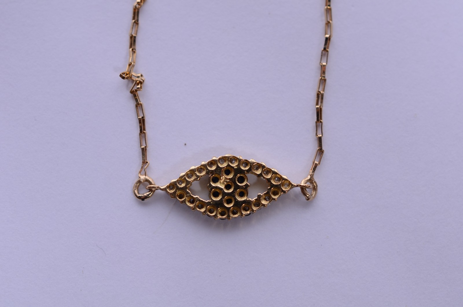 Colar com pendente feitio olho grego de ouro 18 k. (Por motivos de... - foto 5 de 6