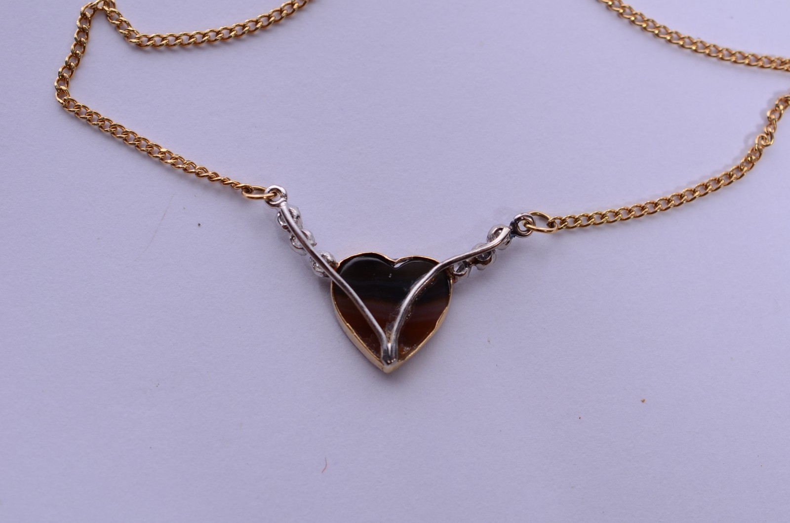 Colar de ouro 18 k., pendente feitio coração com 6 brilhantes. (Por... - foto 4 de 7