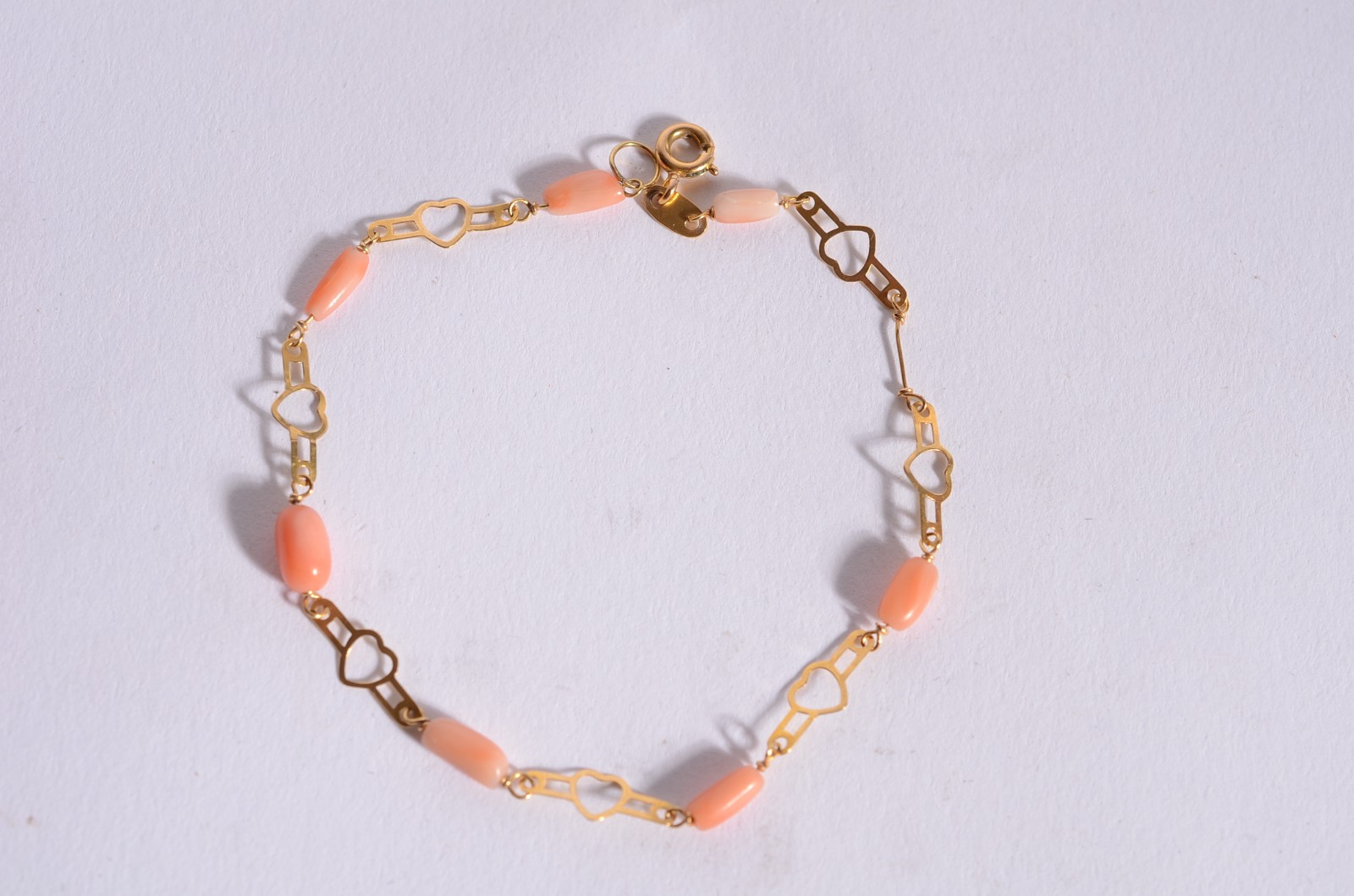 Pulseira de ouro 18 k., contraste 725 mls com pedras corais. (Por... - foto 1 de 4