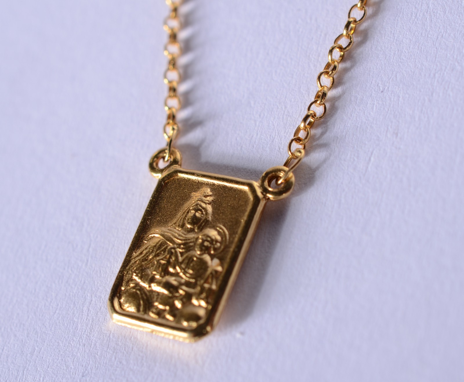 Colar com medalha de ouro 18 k., contraste 750 mls feitio elinhos e... - foto 7 de 10