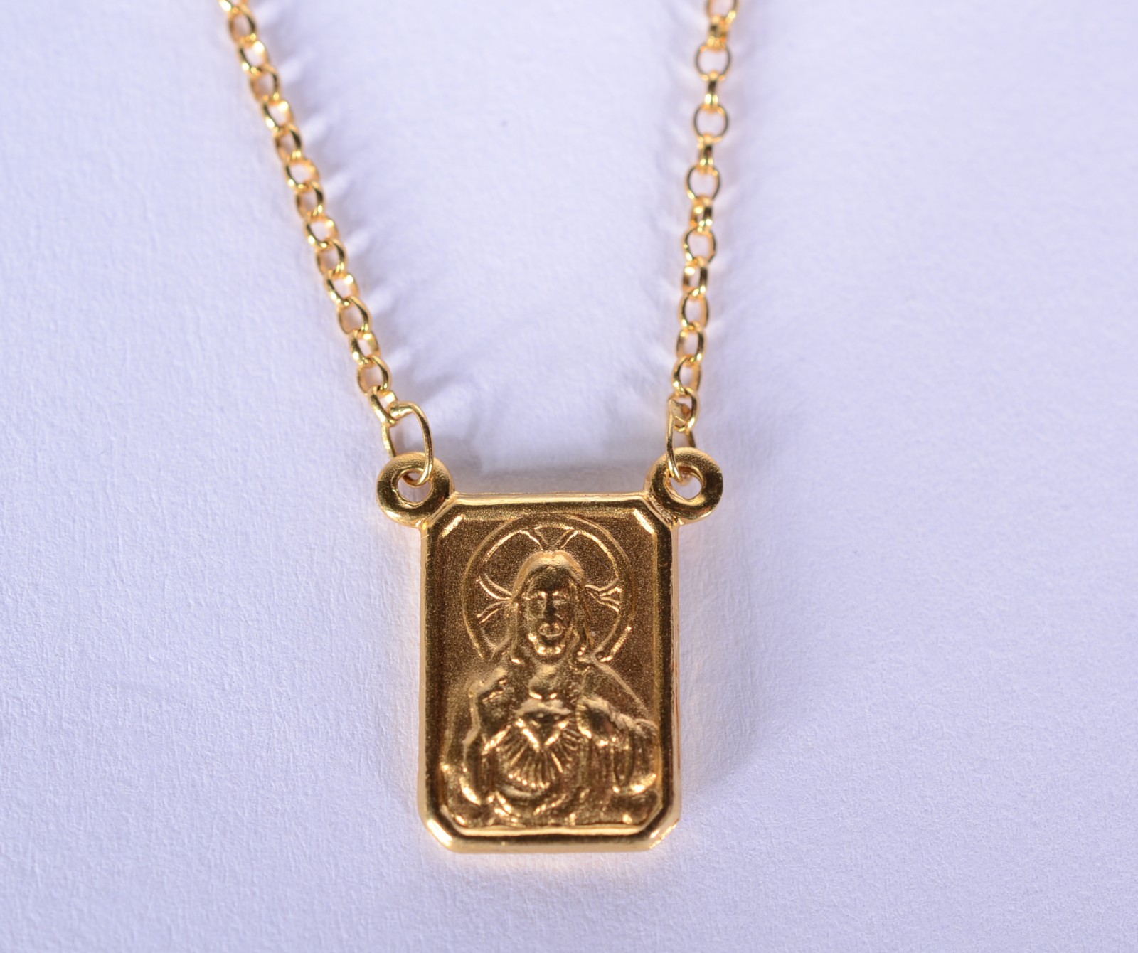 Colar com medalha de ouro 18 k., contraste 750 mls feitio elinhos e... - foto 9 de 10