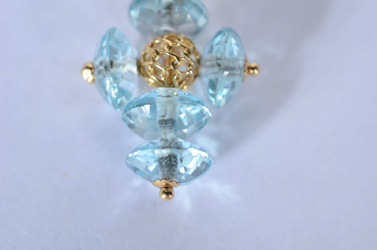 Pendente de ouro 18 k., contraste 750 mls na forma de cruz com pedras... - foto 2 de 5