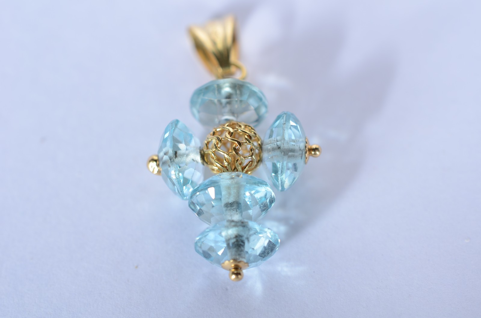 Pendente de ouro 18 k., contraste 750 mls na forma de cruz com pedras... - foto 3 de 5