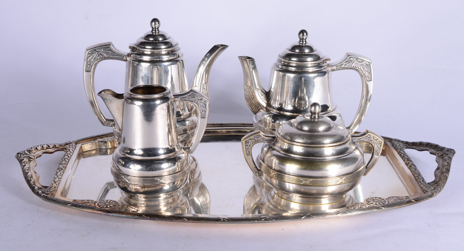 Serviço para chá e café de metal prateado, composto de 2 bules... - foto 1 de 9