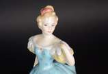 Royal Doulton (1815),  - Duas esculturas de porcelana Royal Doulton policromada representando moças.