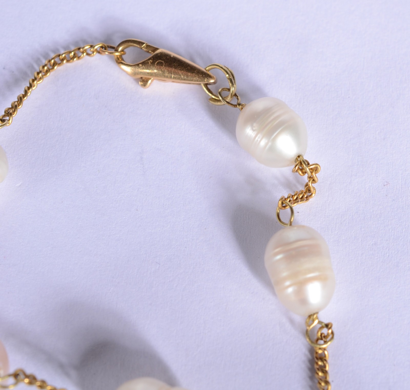 Pulseira de ouro 18 k., contraste 750 mls com cinco perolas... - foto 3 de 5