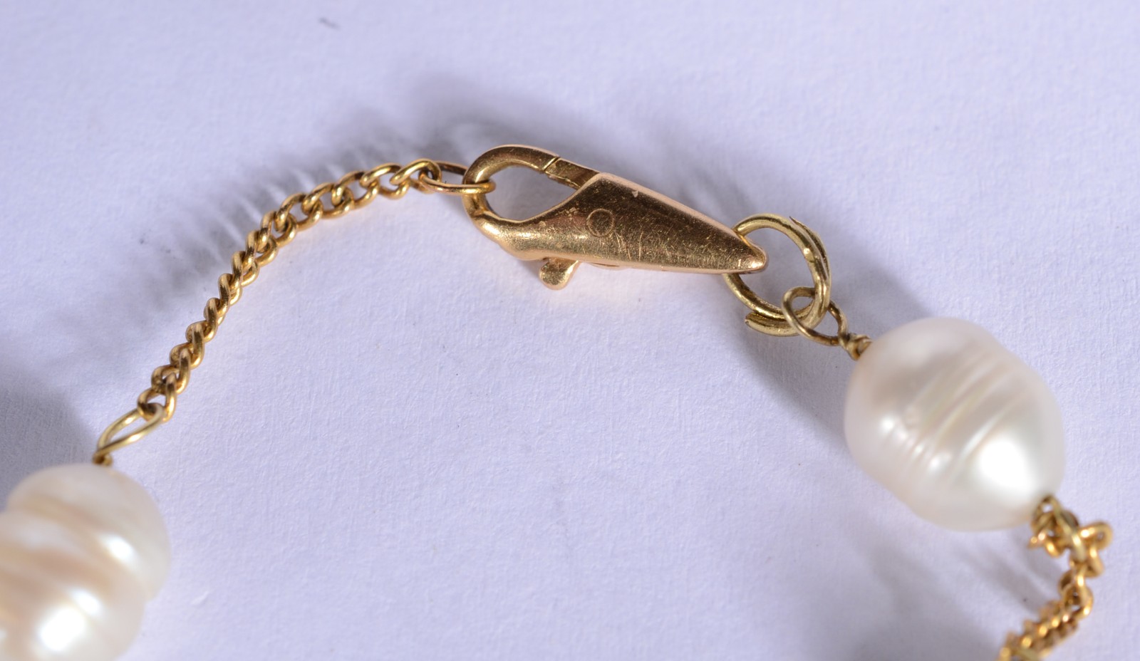 Pulseira de ouro 18 k., contraste 750 mls com cinco perolas... - foto 4 de 5