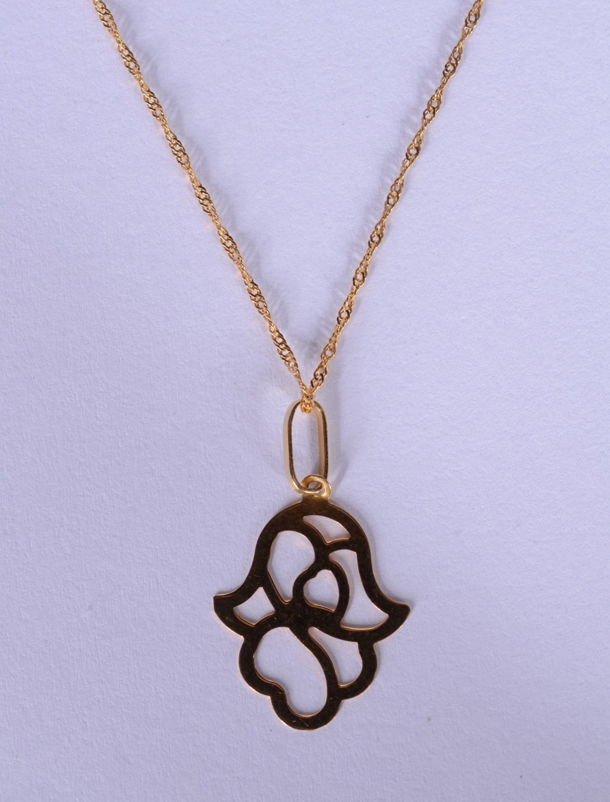Colar de ouro 18k., pendente feitio mão de Hamsa. (Por motivos de... - foto 1 de 5