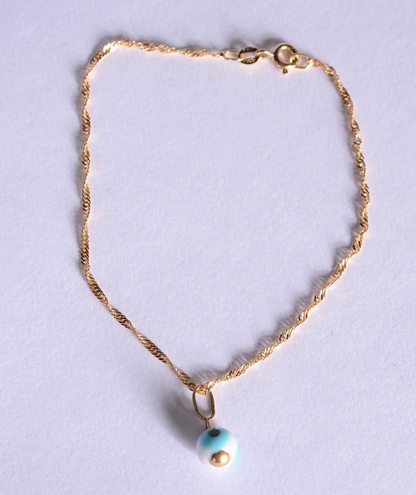 Pulseira com pendente de olho grego de ouro 18k., contraste 750 mls... - foto 2 de 4