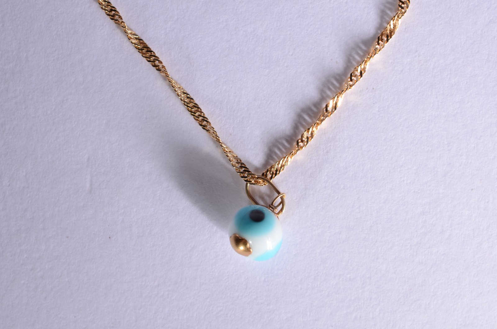 Pulseira com pendente de olho grego de ouro 18k., contraste 750 mls... - foto 1 de 4