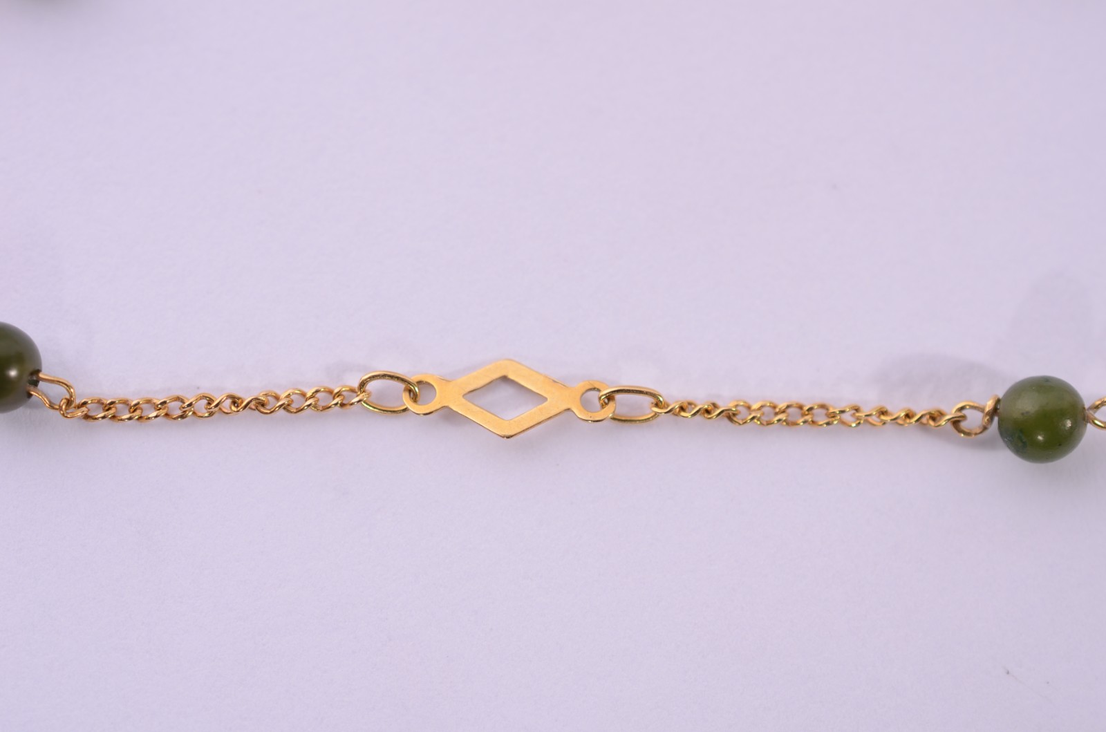 Pulseira de ouro 18 k., com pedras verdes. (Por motivos de segurança... - foto 1 de 7