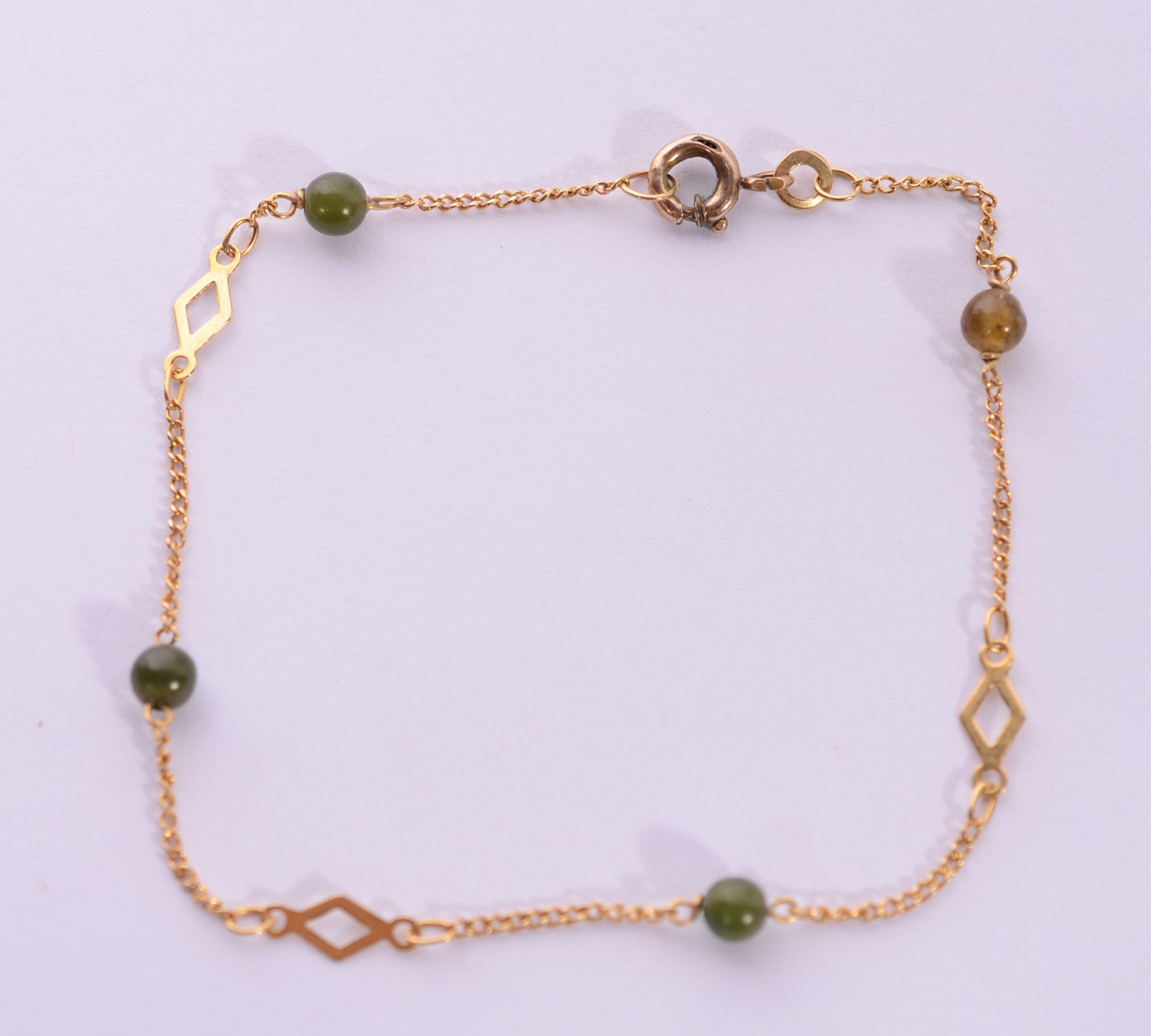 Pulseira de ouro 18 k., com pedras verdes. (Por motivos de segurança... - foto 2 de 7