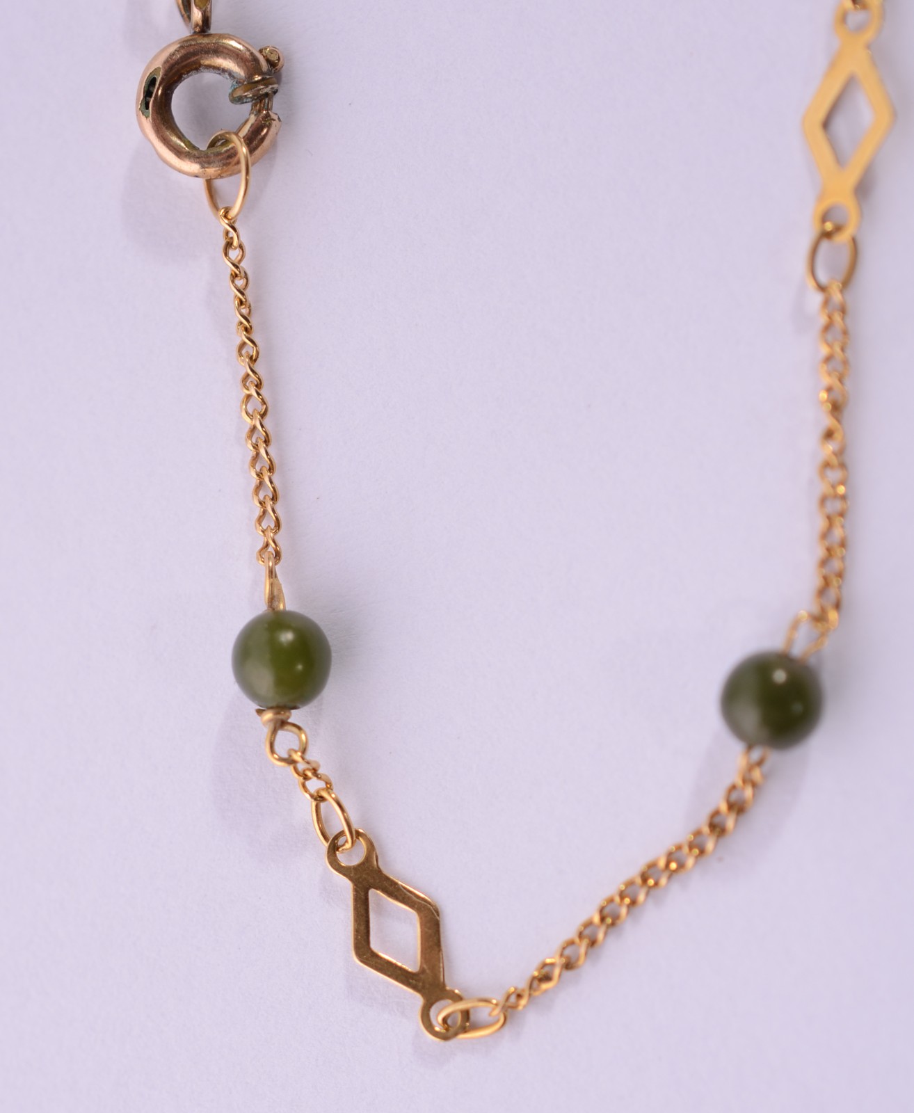 Pulseira de ouro 18 k., com pedras verdes. (Por motivos de segurança... - foto 4 de 7