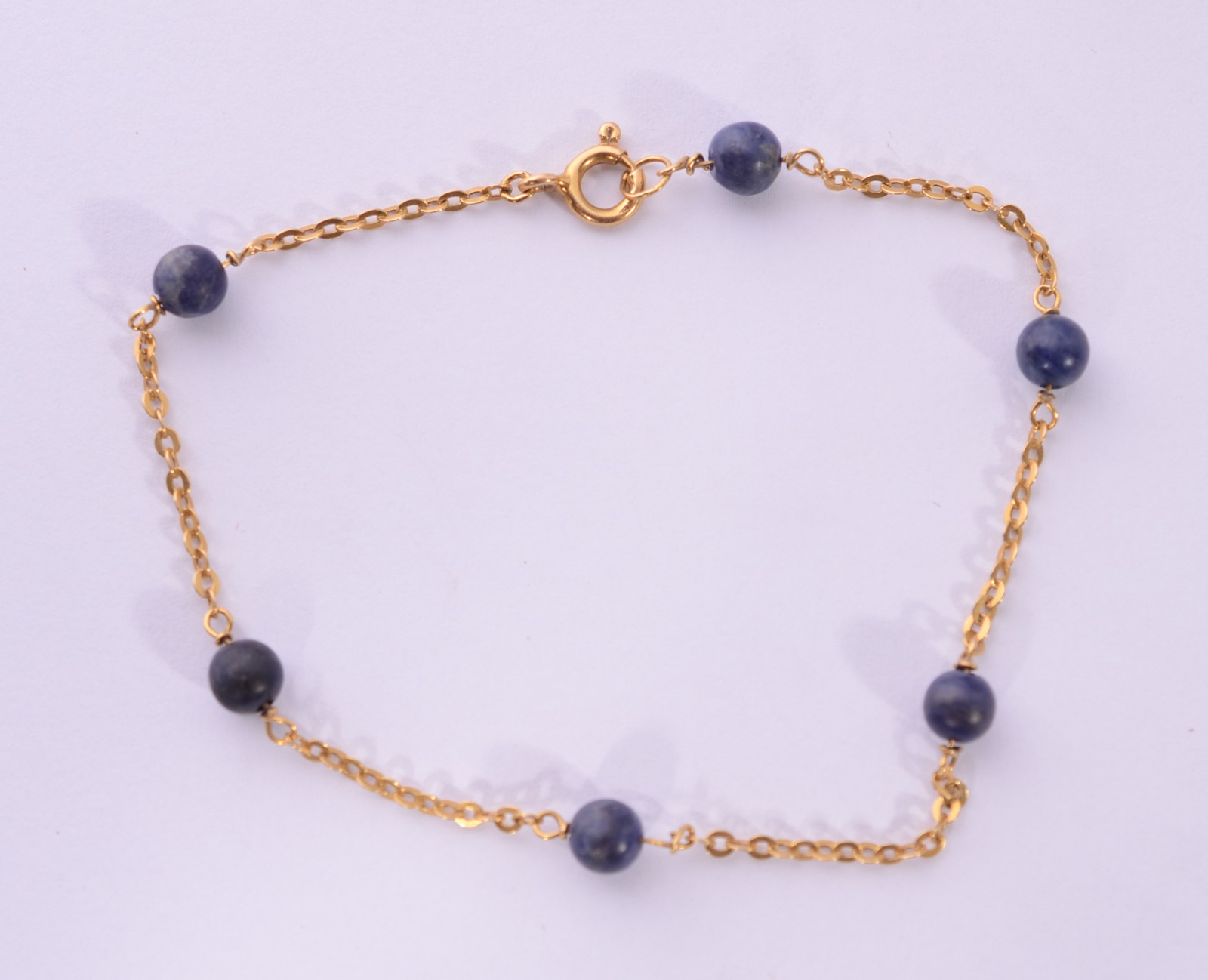 Pulseira de ouro 18 k., com pedras azuis. (Por motivos de segurança a... - foto 2 de 5