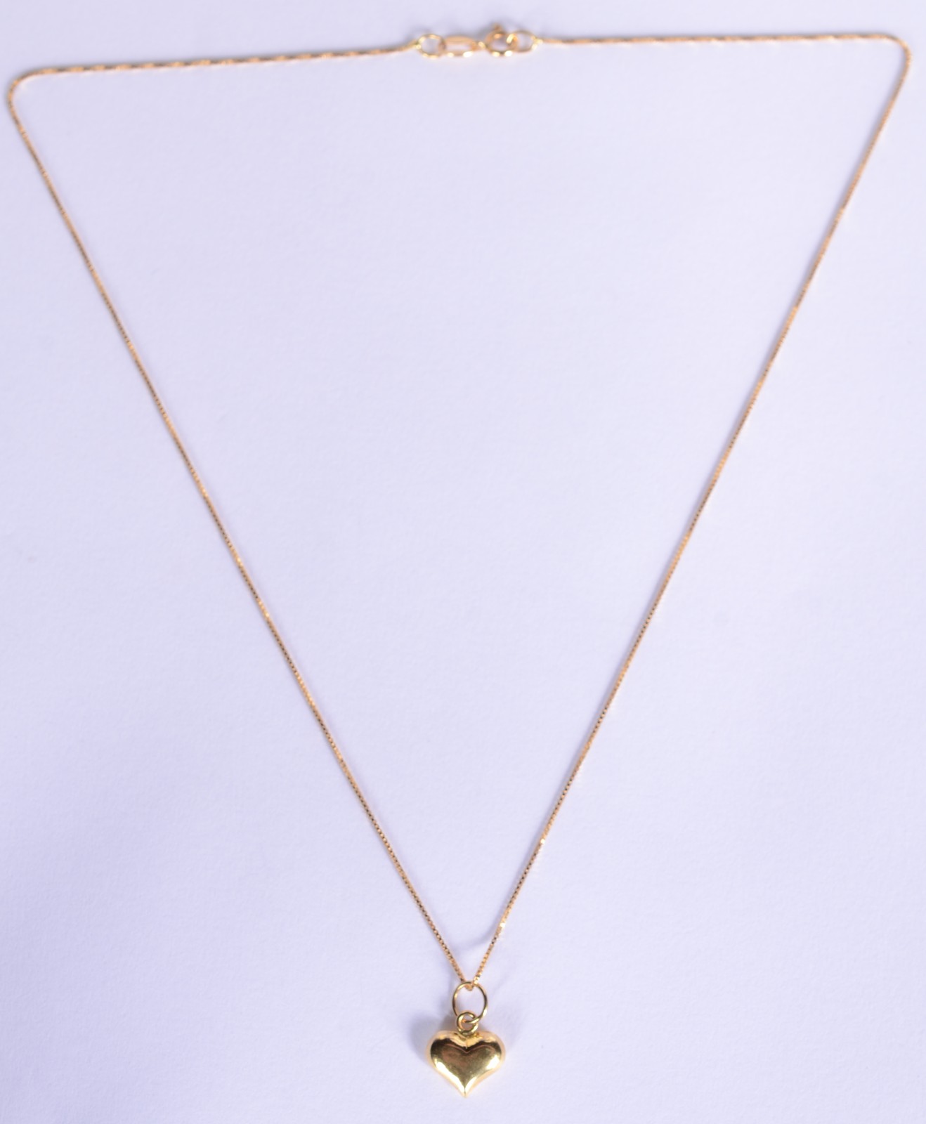 Colar com pendente na forma de coração de ouro 18k., contraste 750... - foto 2 de 5