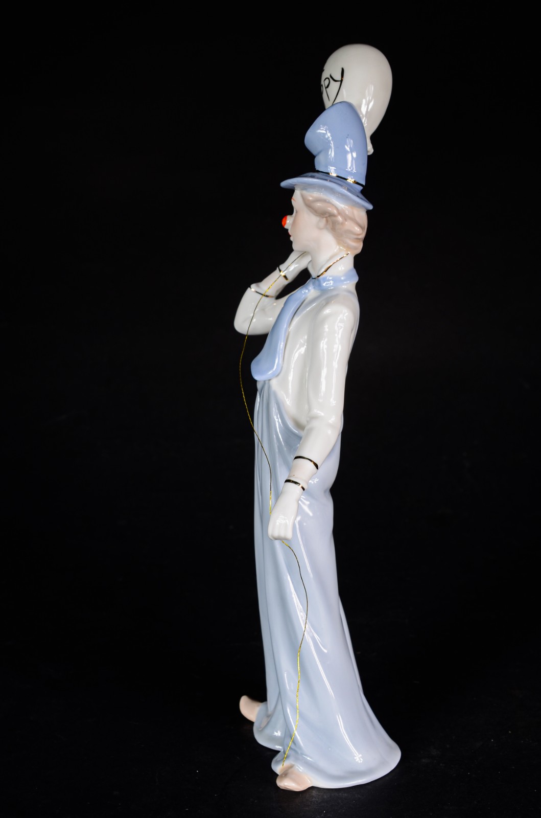 Estatueta de porcelana policromada representando palhaço. - foto 4 de 6