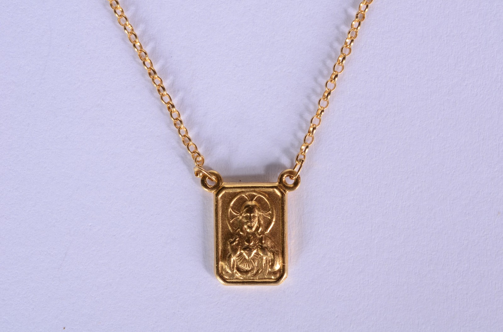 Colar com pendente com figura de Cristo de ouro 18 k., contraste 750... - foto 1 de 6