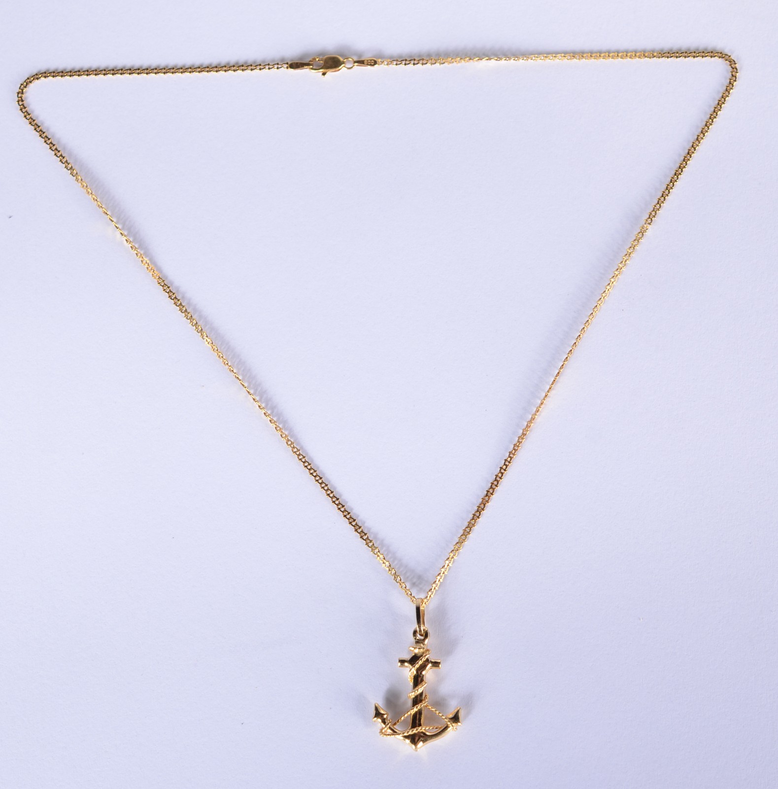 Colar com pendente feitio âncora de ouro 18 k., contraste 750 mls... - foto 2 de 4