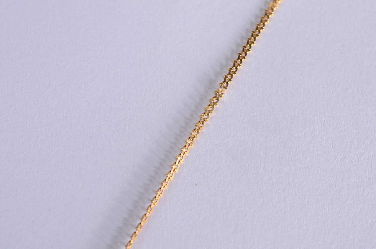 Colar com pendente feitio âncora de ouro 18 k., contraste 750 mls... - foto 3 de 4