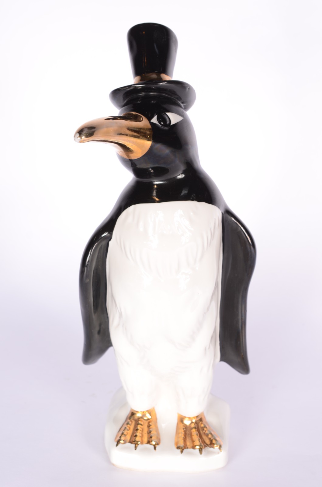 Estatueta de porcelana policromada representando pinguim de cartola. - foto 1 de 7