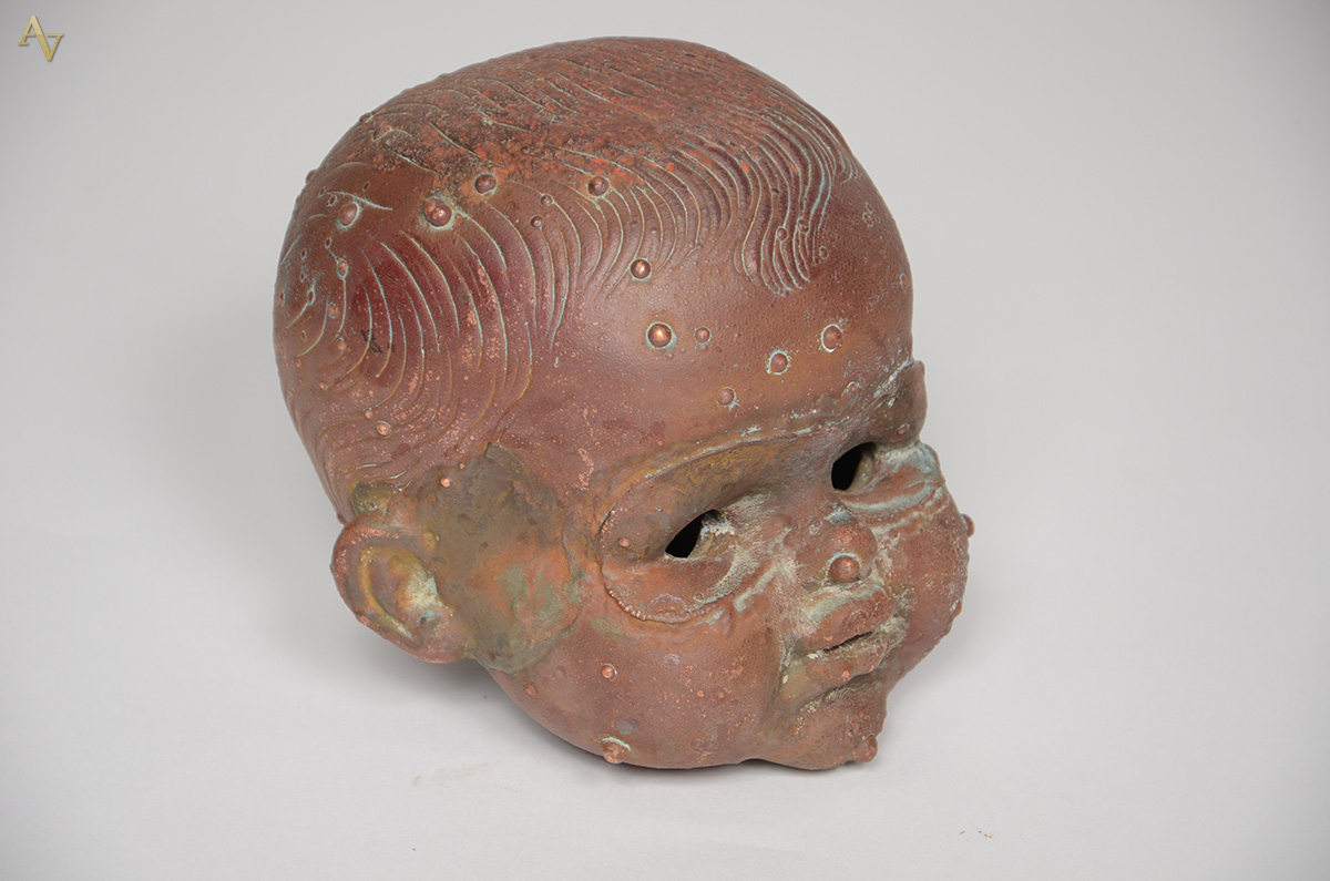 Estatueta de bronze representando Rosto de criança. Altura 16 cm. - foto 1 de 2
