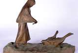 Hans Muller (Austria, 1873-1937),  - Escultura de bronze representando figura com patos.