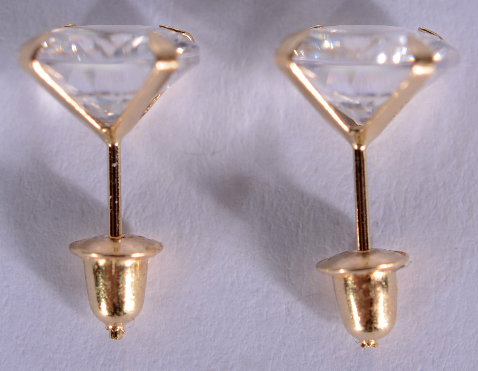 Par de brincos de ouro 18 k., contraste 750 mls com duas pedras... - foto 3 de 4