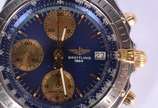 Breitling (1884),  - Relógio de pulso, automático com cronógrafo em aço e ouro.