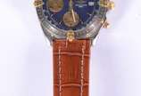 Breitling (1884),  - Relógio de pulso, automático com cronógrafo em aço e ouro.