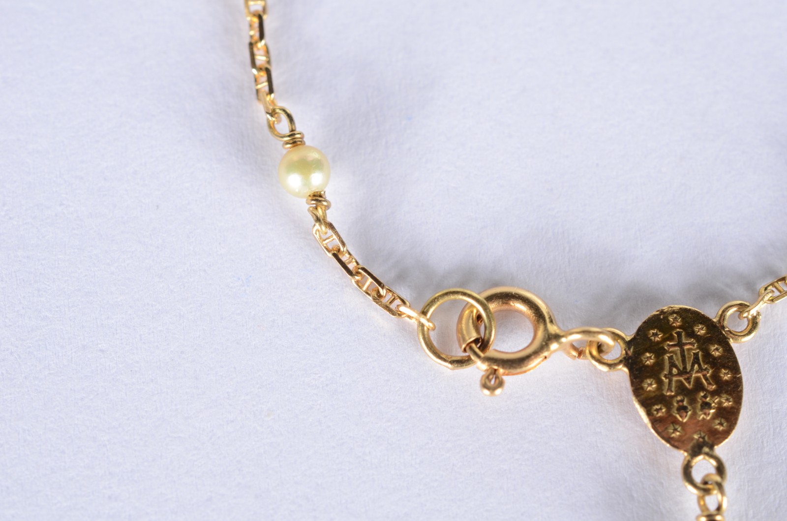 Pulseira de ouro 18 k., contraste 750 mls com perolas e cruz. (Por... - foto 6 de 6