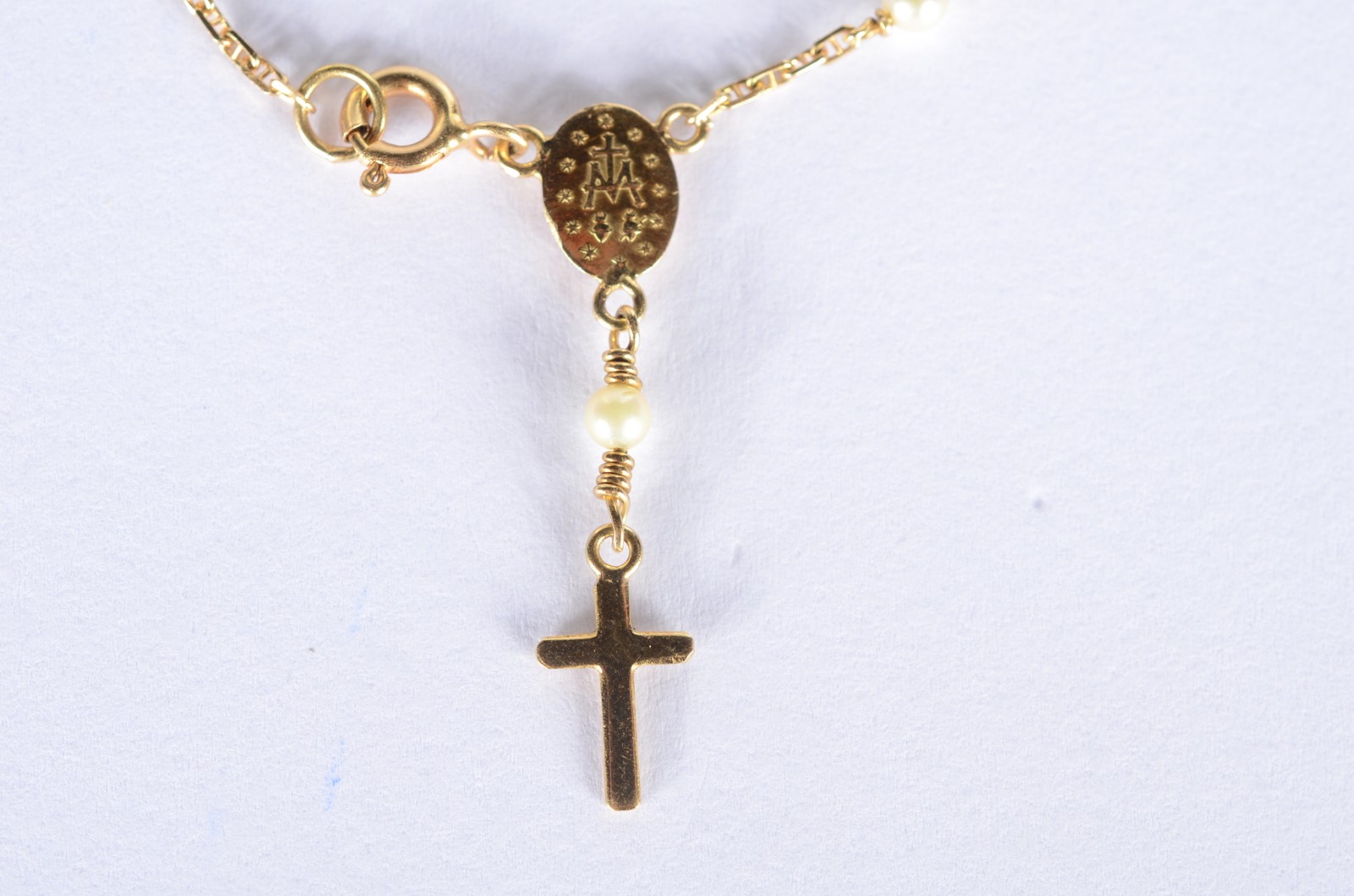Pulseira de ouro 18 k., contraste 750 mls com perolas e cruz. (Por... - foto 1 de 6