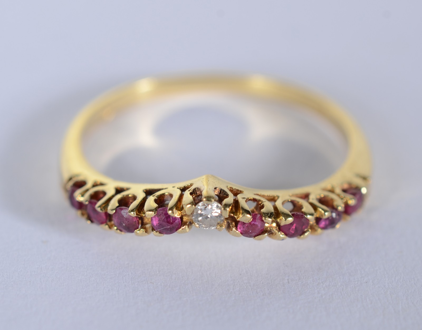 Anel de ouro 18 k., contraste 750 mls com rubilitas e brilhante, aro... - foto 1 de 5