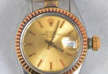 Rolex (1905),  - Relógio Rolex Oyster Perpetual, fundo do mostrador dourado, calendário,  pulseira de aço e ouro. (mostrador 2,4 cm)
