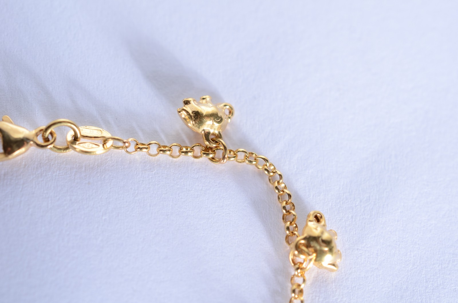 Pulseira com pendente feitio elefantes de ouro 18 k., contraste 750... - foto 4 de 7