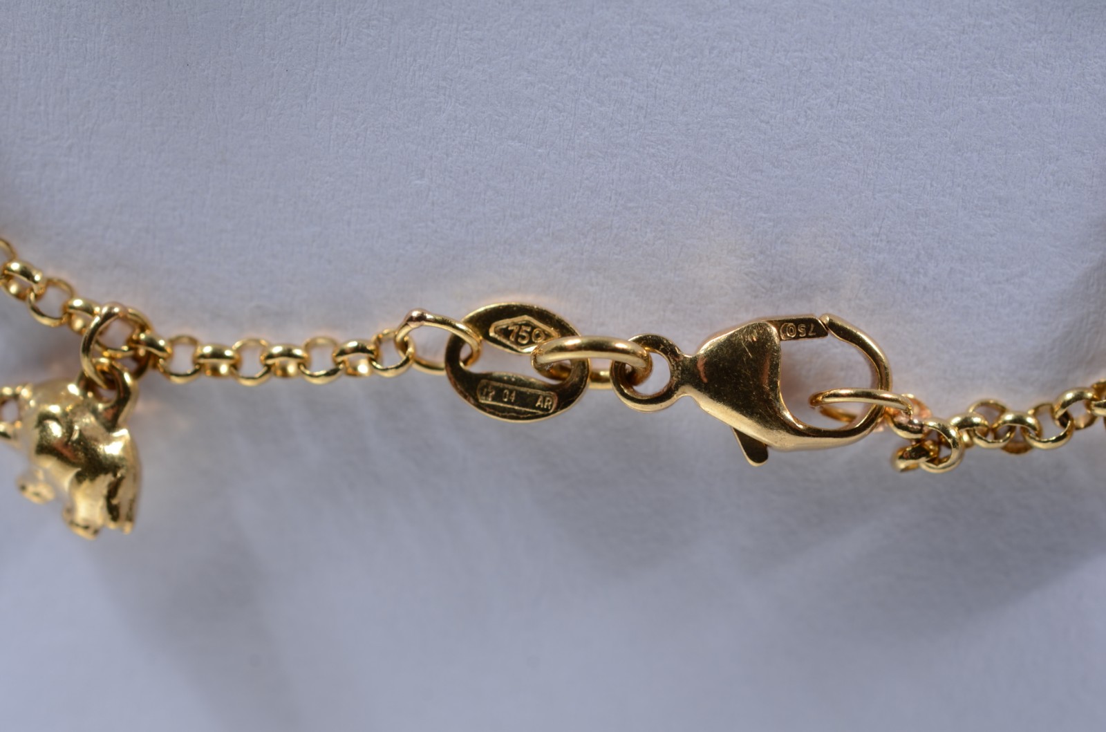Pulseira com pendente feitio elefantes de ouro 18 k., contraste 750... - foto 5 de 7