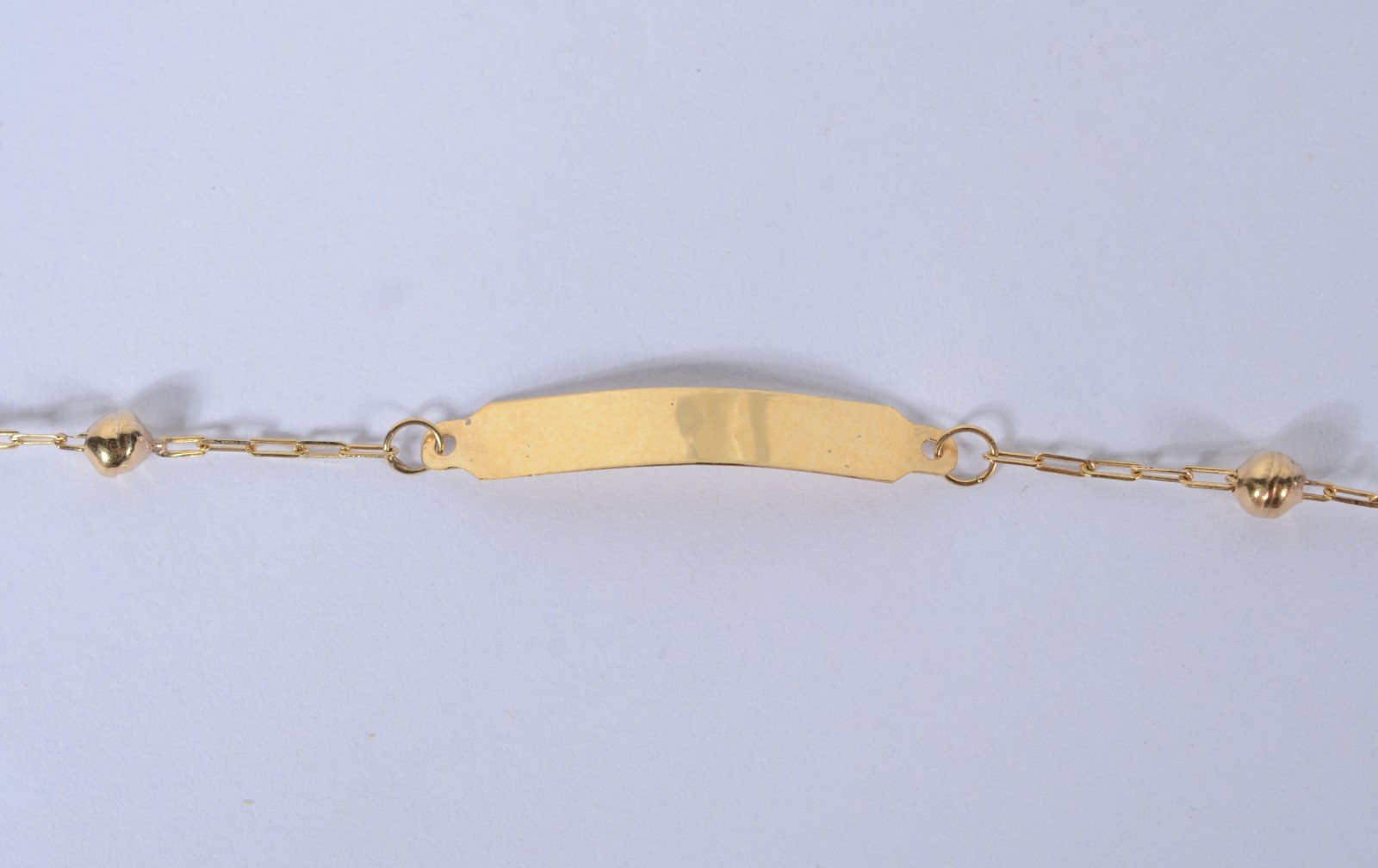Pulseira de criança com "bolinhas" de ouro 18k. (Por motivos de... - foto 1 de 4