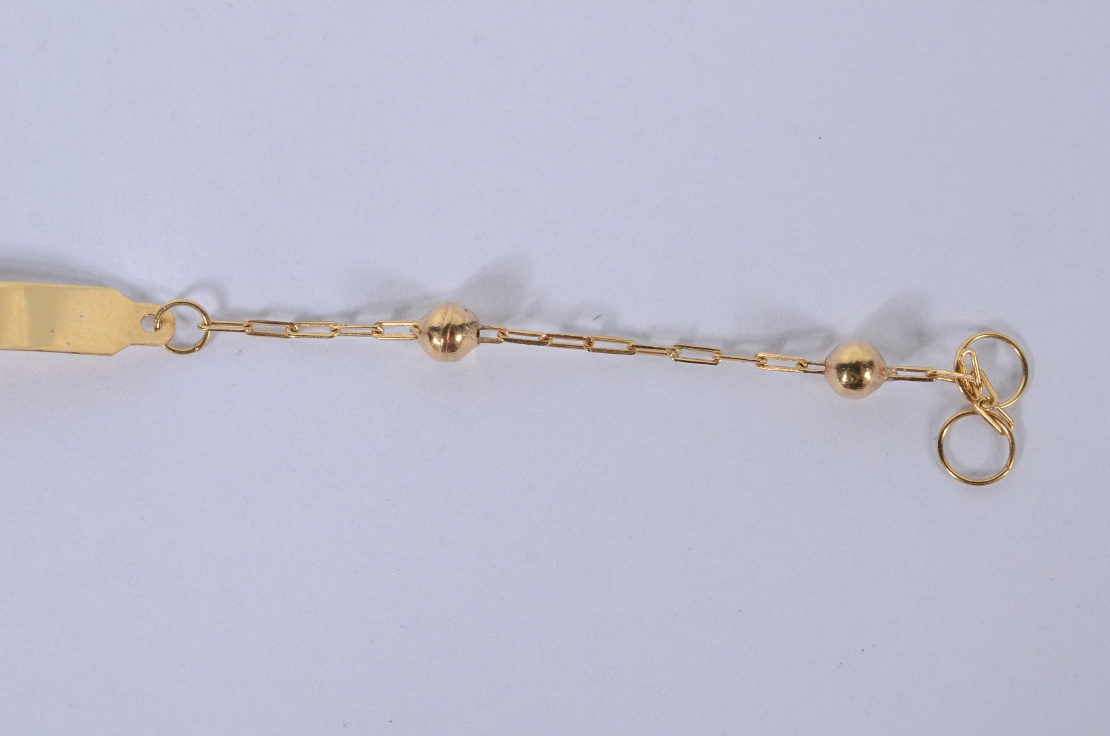 Pulseira de criança com "bolinhas" de ouro 18k. (Por motivos de... - foto 4 de 4