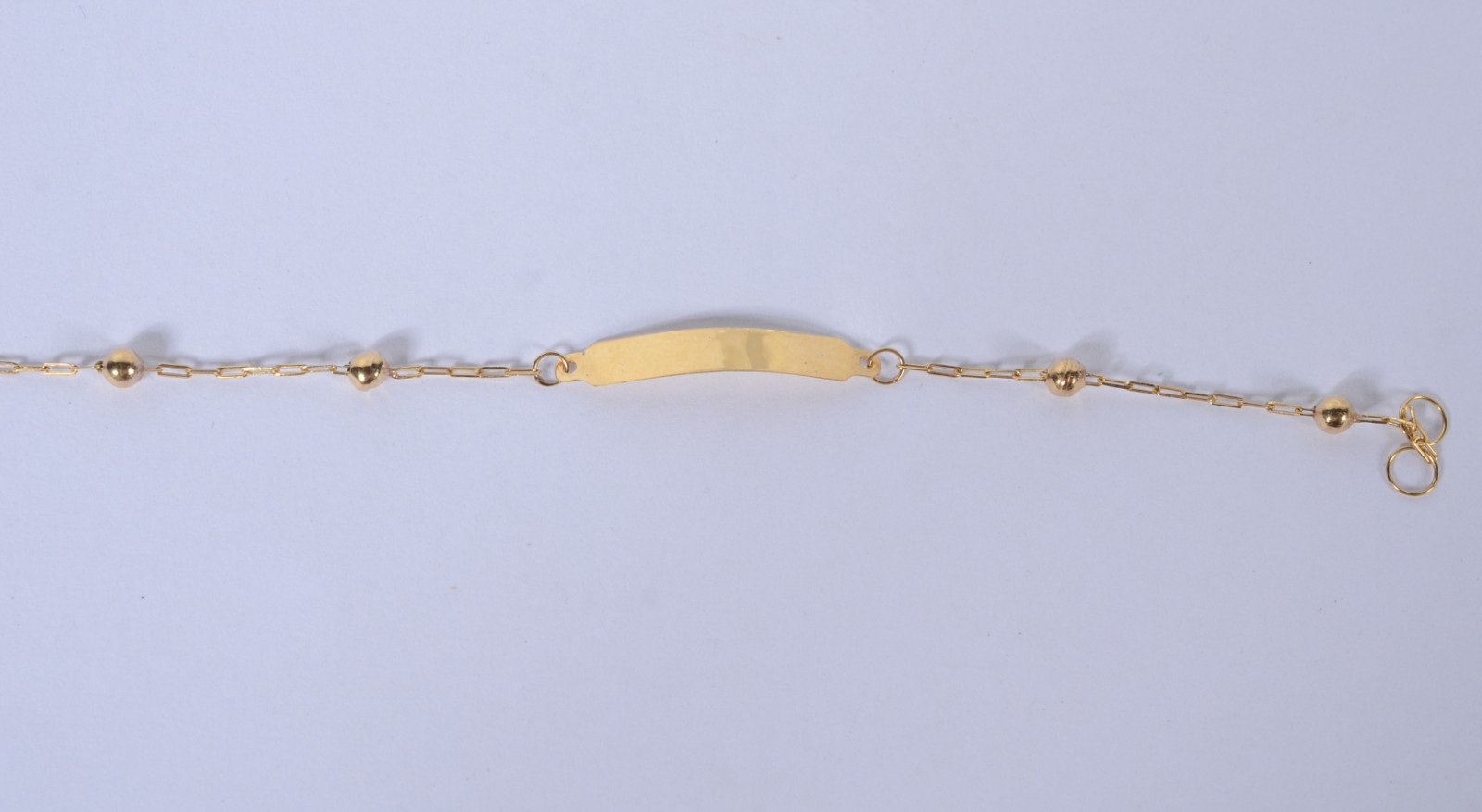 Pulseira de criança com "bolinhas" de ouro 18k. (Por motivos de... - foto 2 de 4