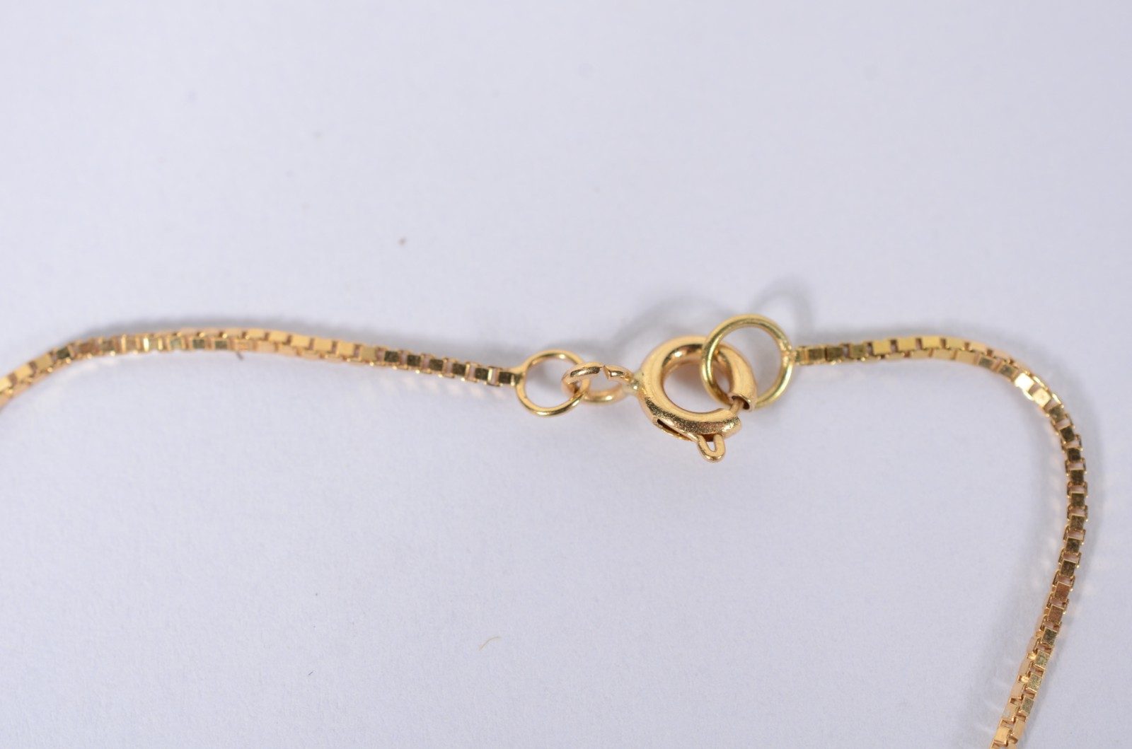 Pulseira com pendente de ouro 18 k., contraste 750 mls. (Por motivos... - foto 3 de 3