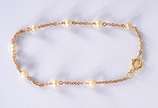Pulseira de criança de ouro 18 k., contraste 75... - Pulseira de criança de ouro 18 k., contraste 750 mls com perolas. (Por motivos de segurança a peça não se encontra na loja).