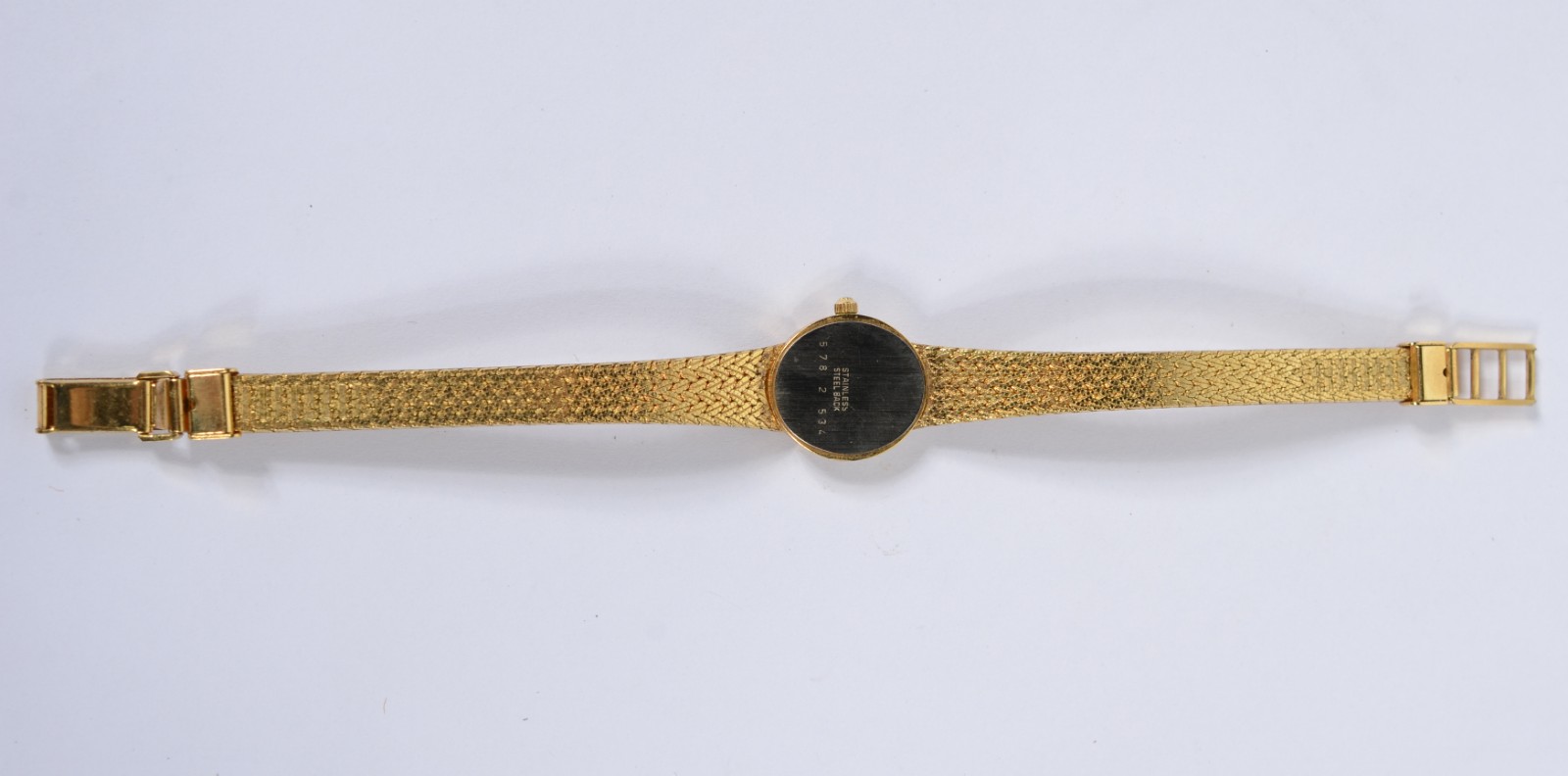 Relógio de pulso de metal dourado, á quartz. Precisando colocar... - foto 4 de 6