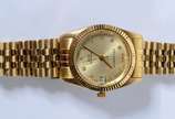 Technos (1900),  - Relógio de pulso feminino, marca Technos, modelo Riviera de aço, com números, caixa e ponteiros dourados. No estojo. (Por motivos de segurança a peça 