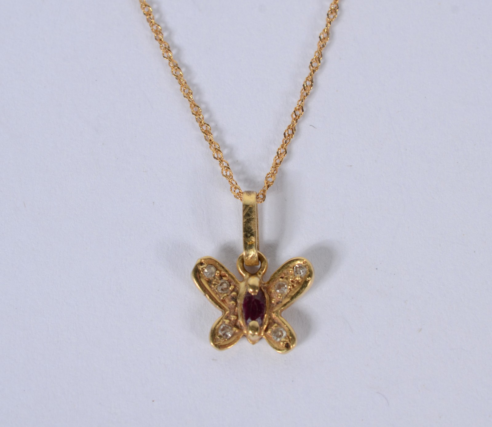 Colar com pendente feitio "borboleta" de ouro 18 k., contraste 750... - foto 1 de 7
