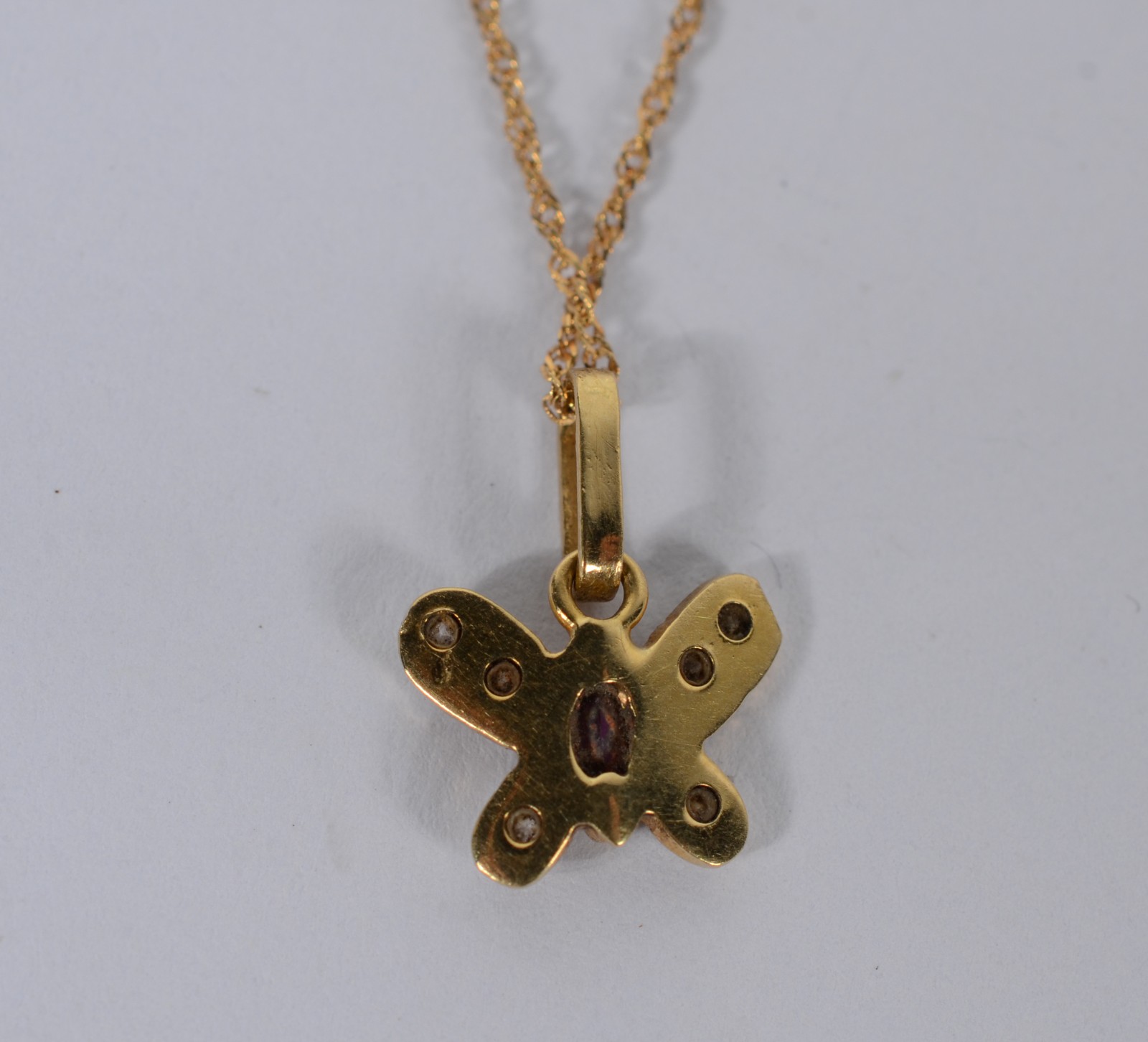 Colar com pendente feitio "borboleta" de ouro 18 k., contraste 750... - foto 6 de 7